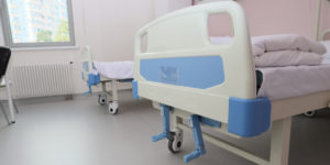 Hospital beds with lifting mechanism