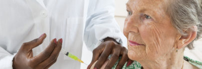 Senior woman getting flu shot