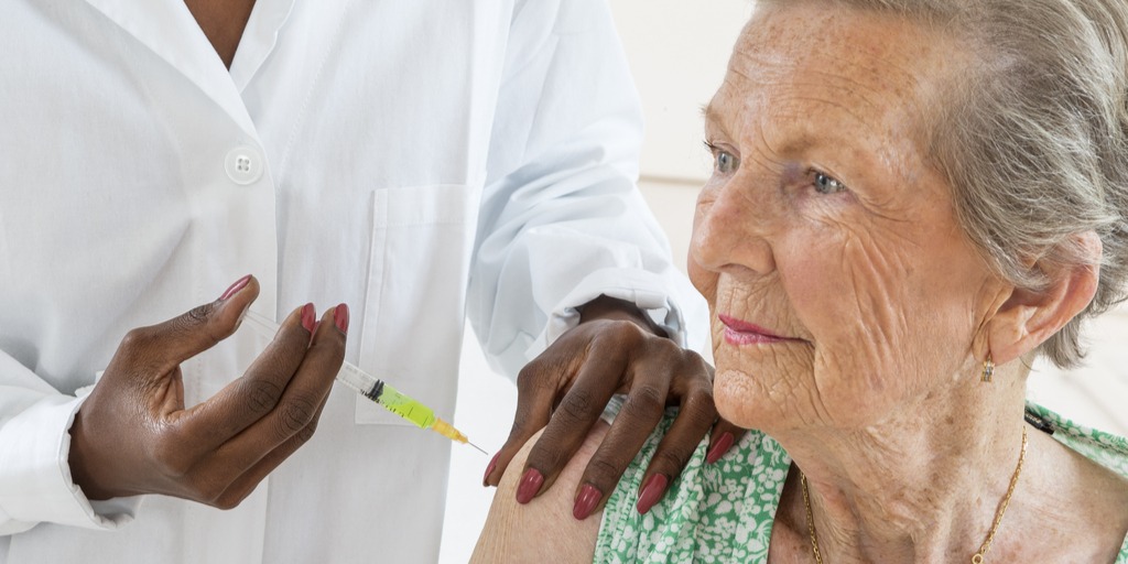 Senior woman getting flu shot