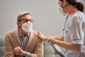 nursing home staffer with resident