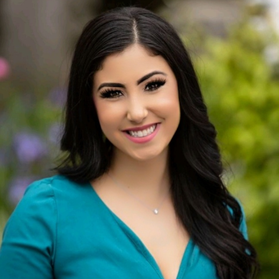 Headshot image of Jenna Ballard smiling while wearing a turquoise shirt