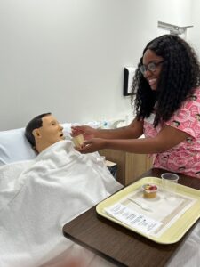CNA trainee student practicing bedside care